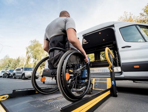 man-wheelchair-moves-lift-specialized-vehicle-people-with-disabilities_179755-10527